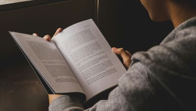 Person reading a document, over-the-shoulder view